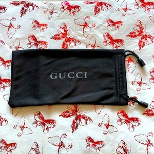 Gucci sunglasses case.